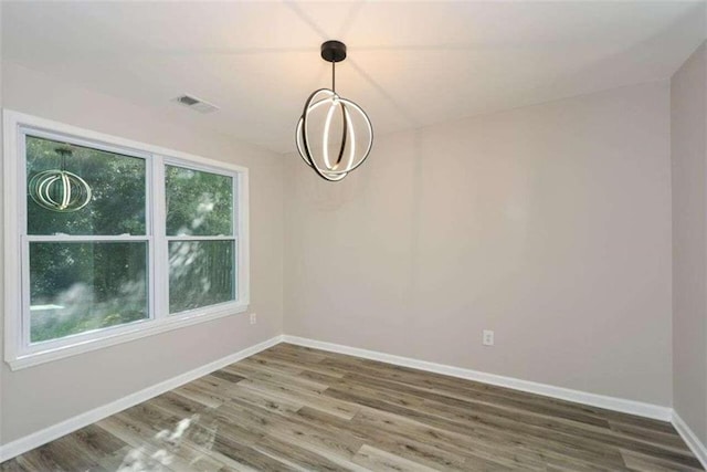 unfurnished dining area with hardwood / wood-style floors