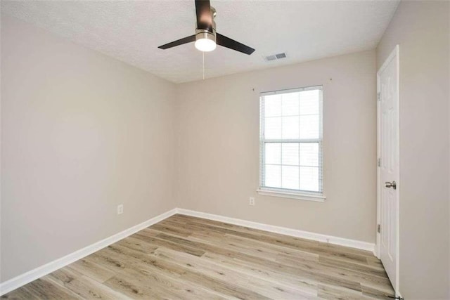 unfurnished room featuring ceiling fan, a textured ceiling, and light hardwood / wood-style flooring