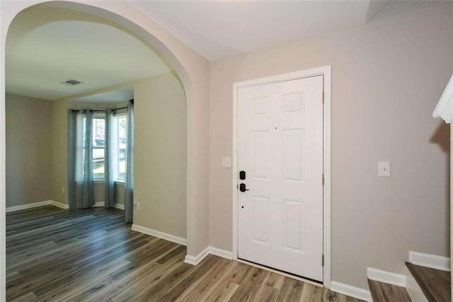 entrance foyer featuring dark hardwood / wood-style flooring