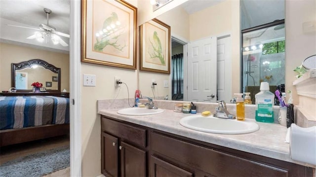 ensuite bathroom with a sink, ensuite bathroom, double vanity, and ceiling fan