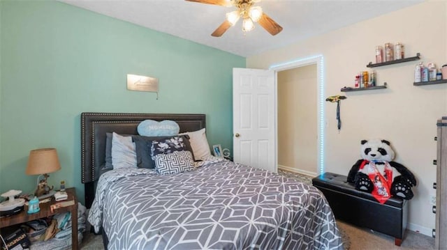 carpeted bedroom with baseboards and ceiling fan