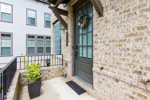 view of exterior entry with a porch