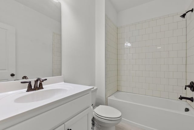 full bathroom with vanity, toilet, and tiled shower / bath combo