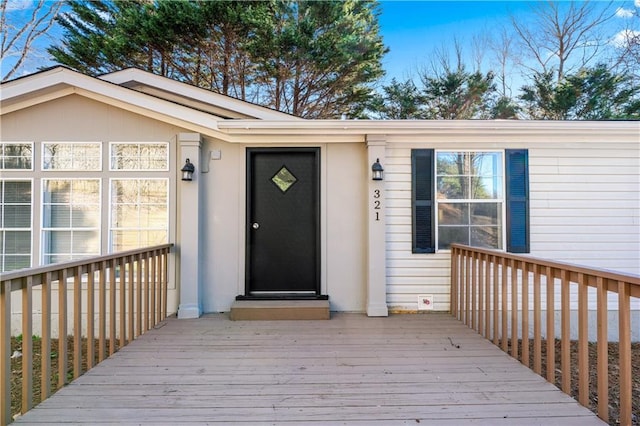 doorway to property with a deck