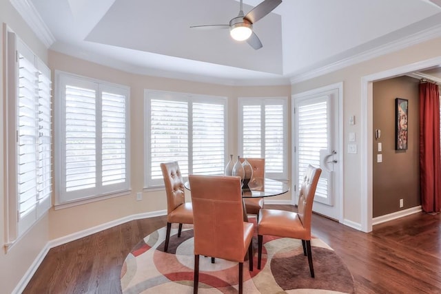 dining area featuring a ceiling fan, baseboards, and dark wood-style flooring