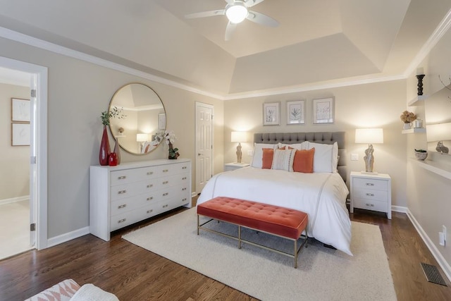 bedroom featuring wood finished floors, visible vents, and baseboards