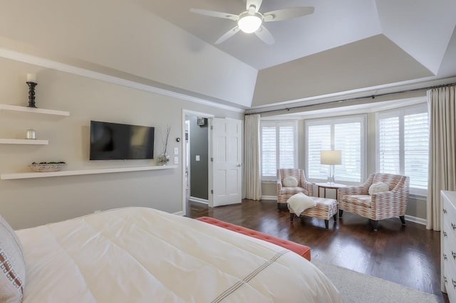 bedroom with lofted ceiling, multiple windows, baseboards, and wood finished floors