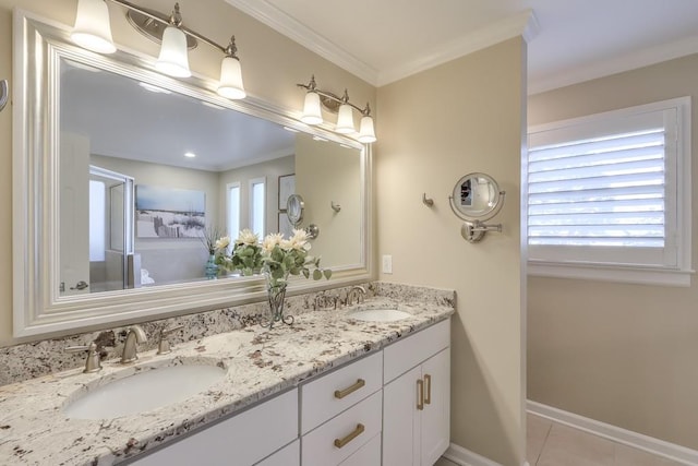 bathroom with ornamental molding, tile patterned flooring, a sink, and double vanity