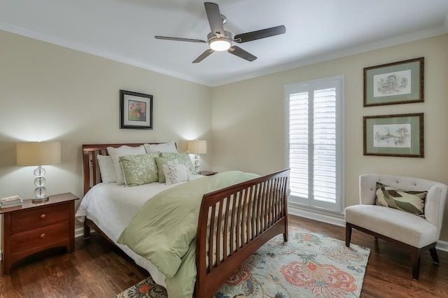 bedroom with multiple windows, wood finished floors, and crown molding