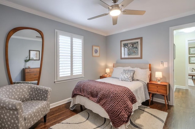 bedroom featuring ceiling fan, crown molding, baseboards, and wood finished floors