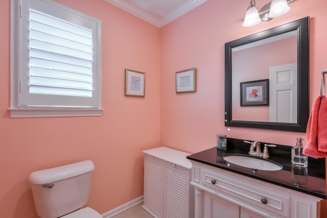 half bathroom featuring crown molding, vanity, and toilet