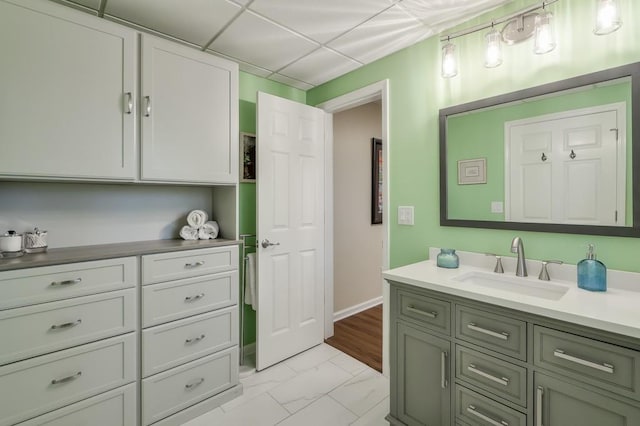 bathroom featuring marble finish floor and vanity