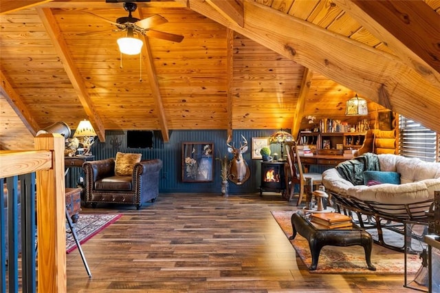 living area featuring rustic walls, ceiling fan, vaulted ceiling with beams, hardwood / wood-style floors, and wood ceiling