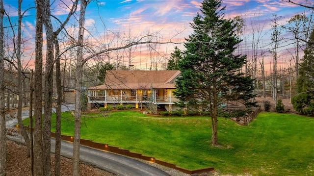 view of front of home featuring a lawn