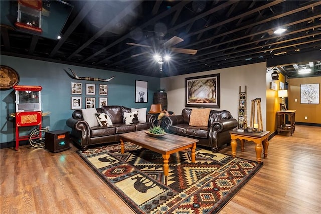 living room with hardwood / wood-style flooring and ceiling fan