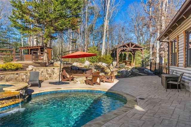 view of swimming pool with an in ground hot tub, a gazebo, a patio, and pool water feature