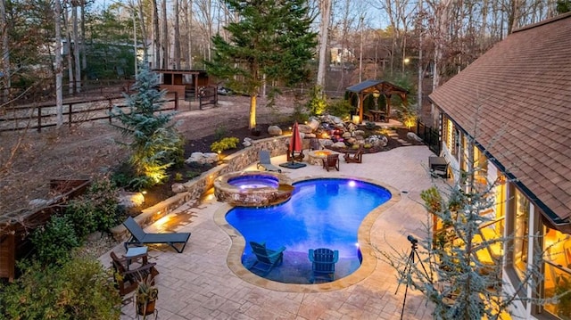 view of pool featuring an in ground hot tub and a patio