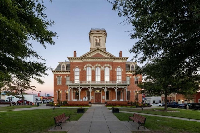 view of outdoor building at dusk