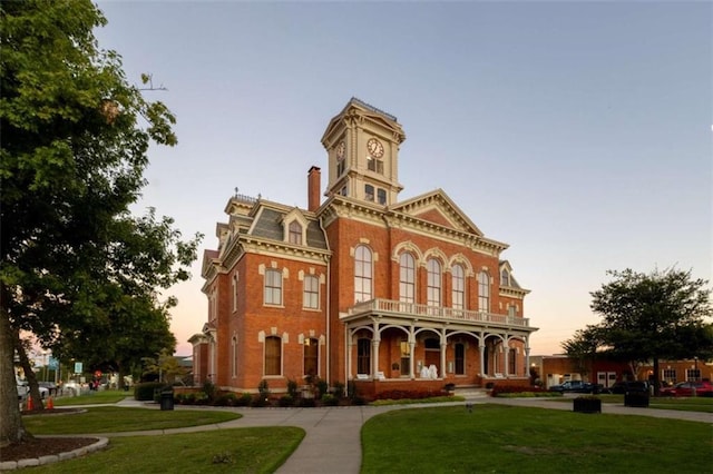 view of outdoor building at dusk