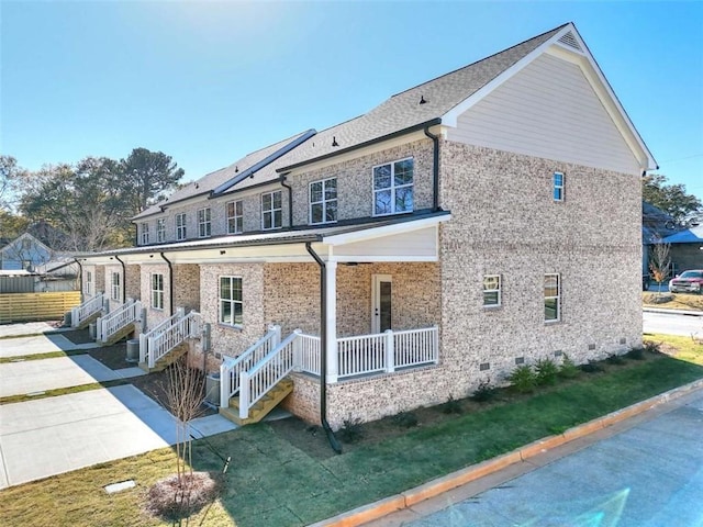 exterior space with a porch and a lawn