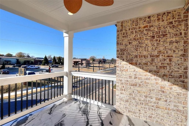 balcony featuring ceiling fan