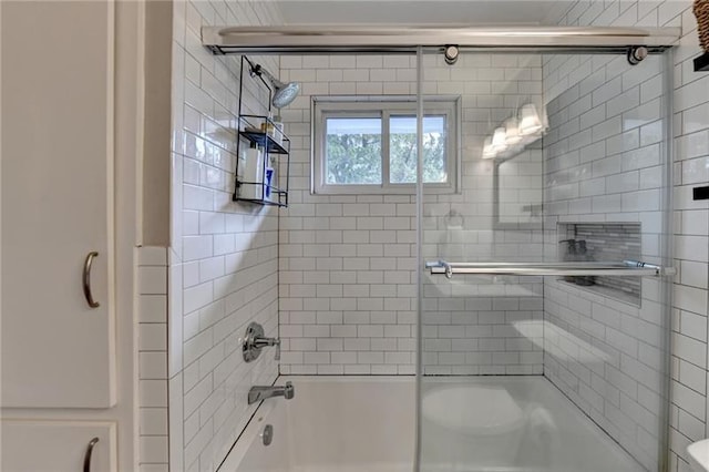 bathroom with enclosed tub / shower combo and toilet