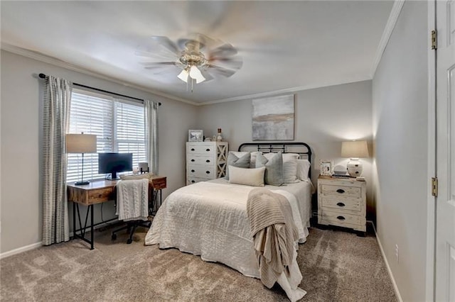 carpeted bedroom featuring ceiling fan, baseboards, and ornamental molding