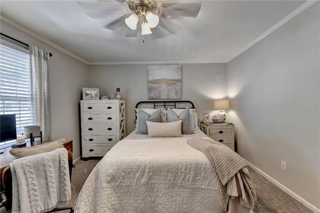 bedroom with ceiling fan, baseboards, carpet floors, and ornamental molding