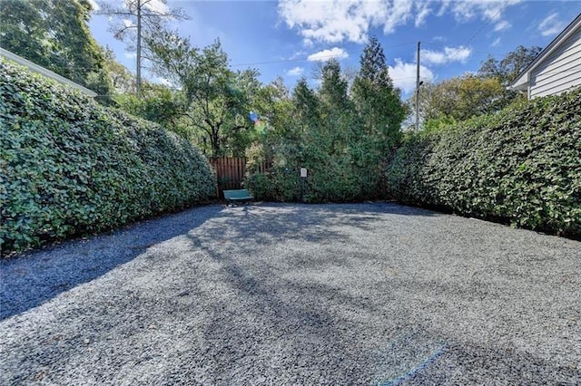 view of patio featuring fence