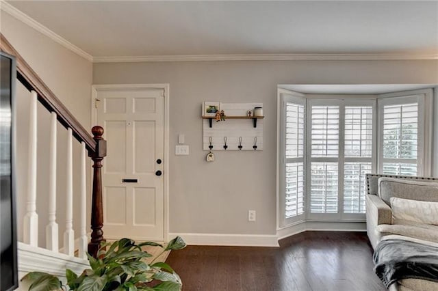 entrance foyer featuring dark wood finished floors, stairway, baseboards, and ornamental molding