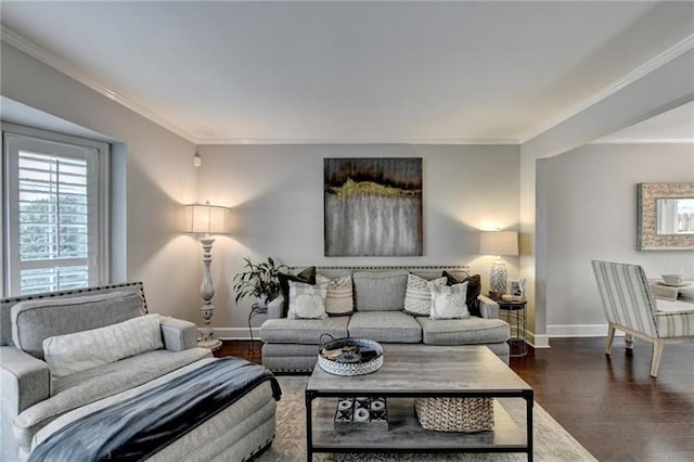 living room featuring crown molding, baseboards, and wood finished floors