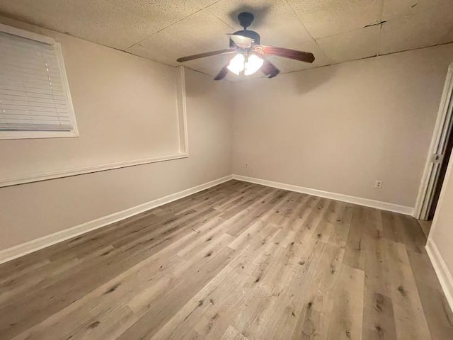 unfurnished room featuring light hardwood / wood-style flooring and ceiling fan