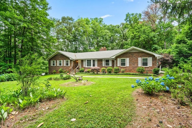 ranch-style home featuring a front yard