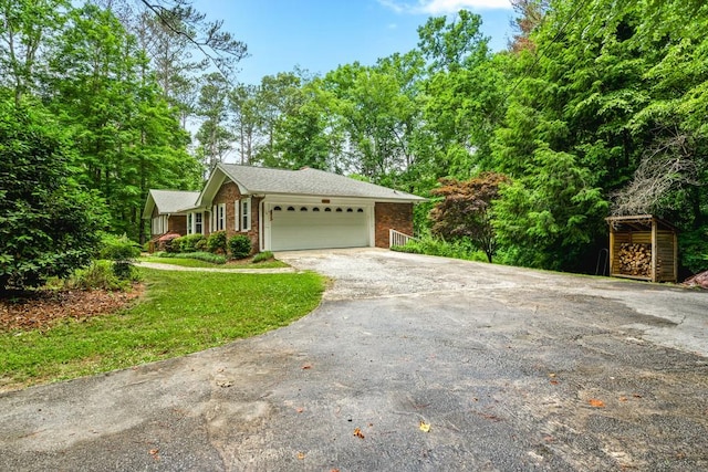 view of front facade with a front lawn and a garage