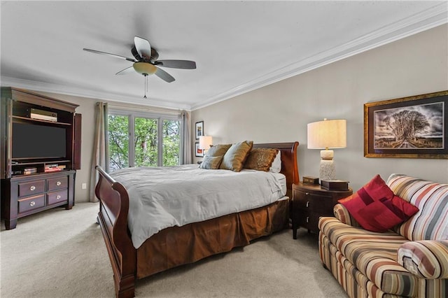 bedroom featuring ceiling fan, light carpet, and crown molding