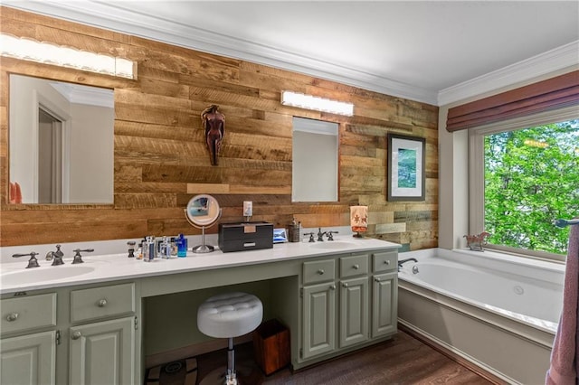 bathroom with wooden walls, a garden tub, crown molding, and vanity