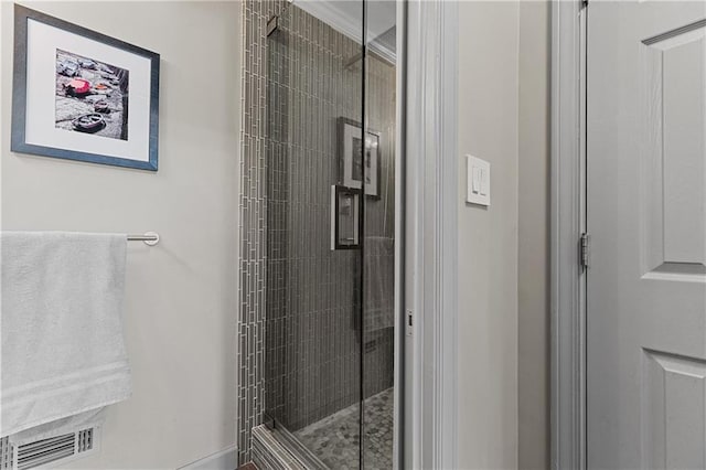 bathroom with visible vents and a stall shower