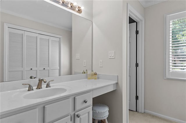 bathroom with baseboards and vanity