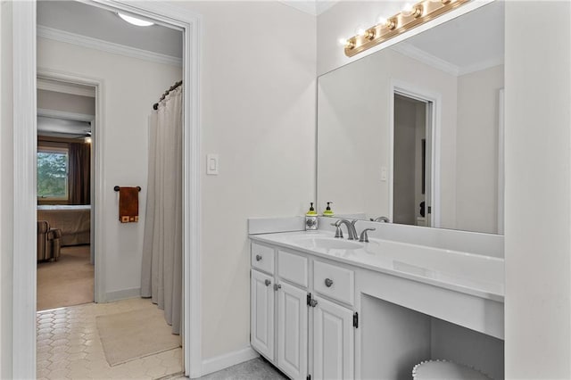 bathroom with baseboards, vanity, tile patterned floors, and crown molding