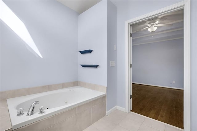 full bathroom with baseboards, tile patterned flooring, a tub with jets, and a ceiling fan