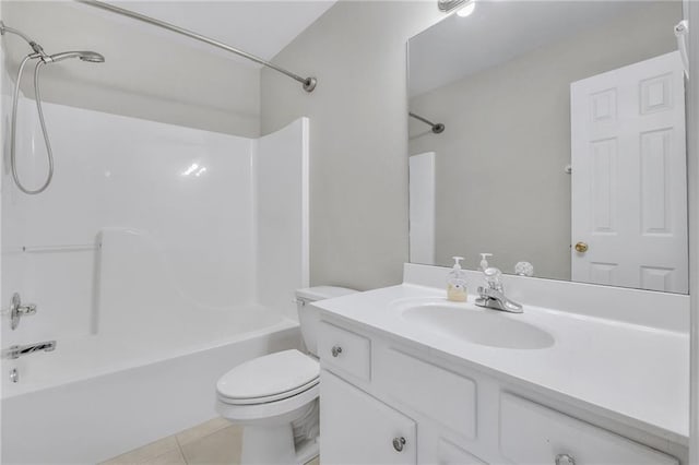 bathroom featuring toilet, tile patterned flooring, shower / washtub combination, and vanity