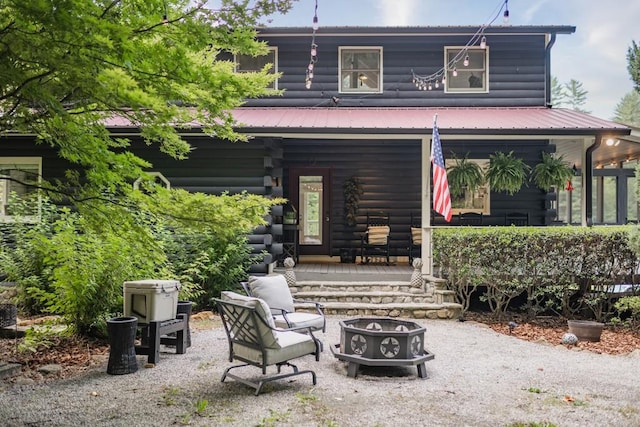 328 Black Ankle Creek Rd, Cherry Log, GA 30522 - back of property featuring an outdoor fire pit