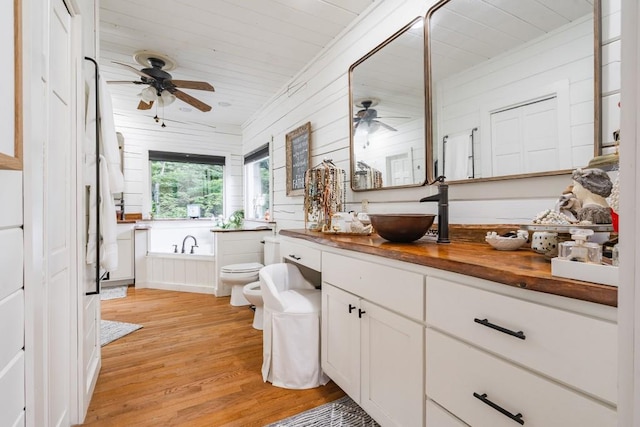 328 Black Ankle Creek Rd, Cherry Log, GA 30522 - bathroom featuring a bidet, a washtub, hardwood / wood-style flooring, vanity, and toilet