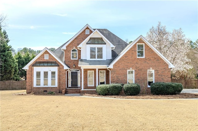 view of front of property with crawl space, fence, and brick siding