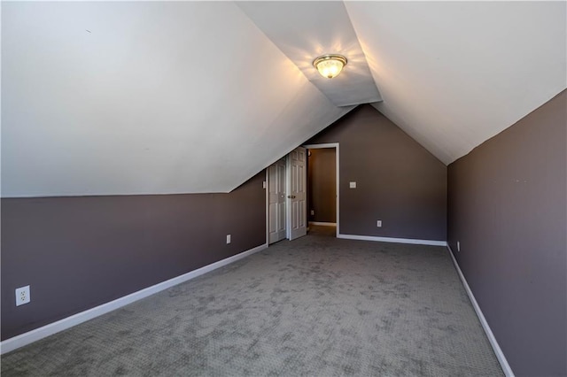 bonus room featuring carpet, baseboards, and vaulted ceiling