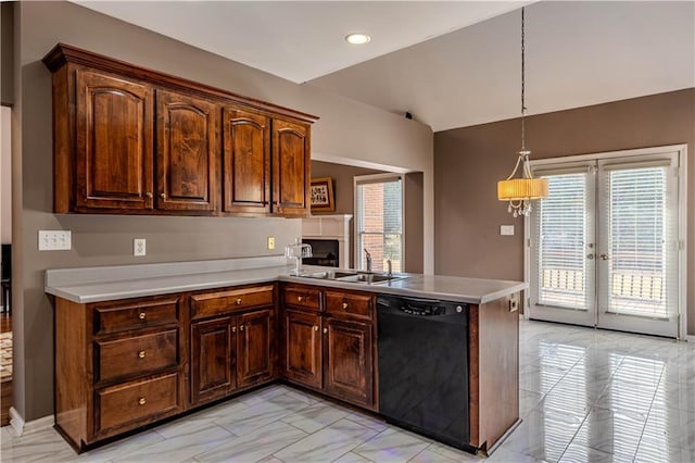 kitchen with black dishwasher, marble finish floor, light countertops, a sink, and a peninsula