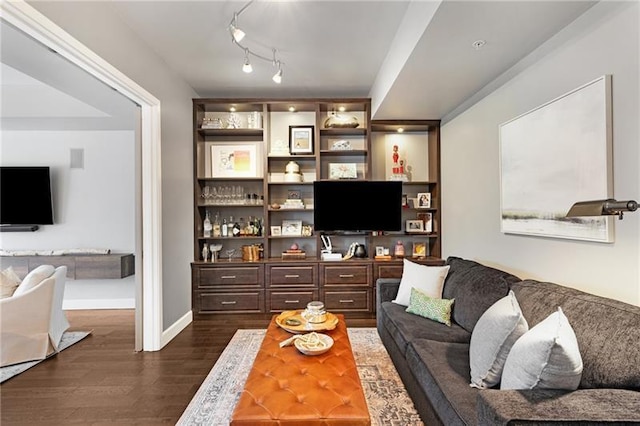 living room with bar and dark hardwood / wood-style flooring