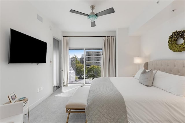 carpeted bedroom featuring access to exterior and ceiling fan