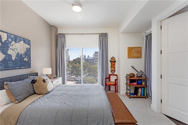 carpeted bedroom featuring ceiling fan