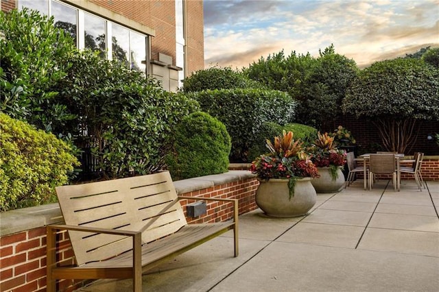 view of patio terrace at dusk